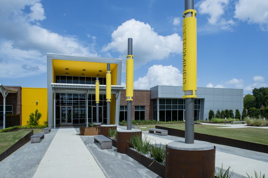 Exterior of EBR-CTEC with tall landscape lights and concrete benches