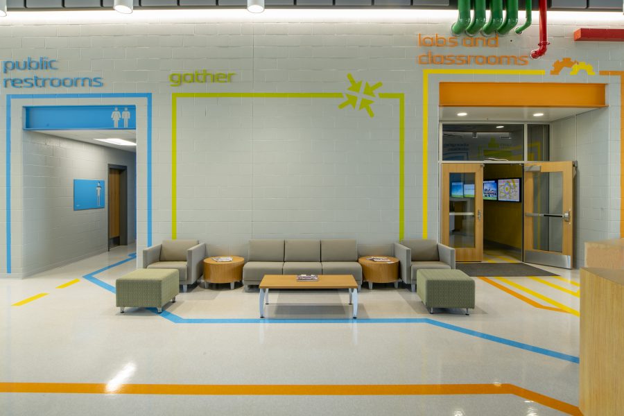 Student common area with bright colors and lounge seating