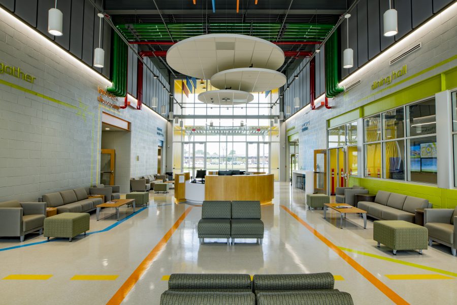 Student Common Area with bright colors, lounging areas, and circular reception desk