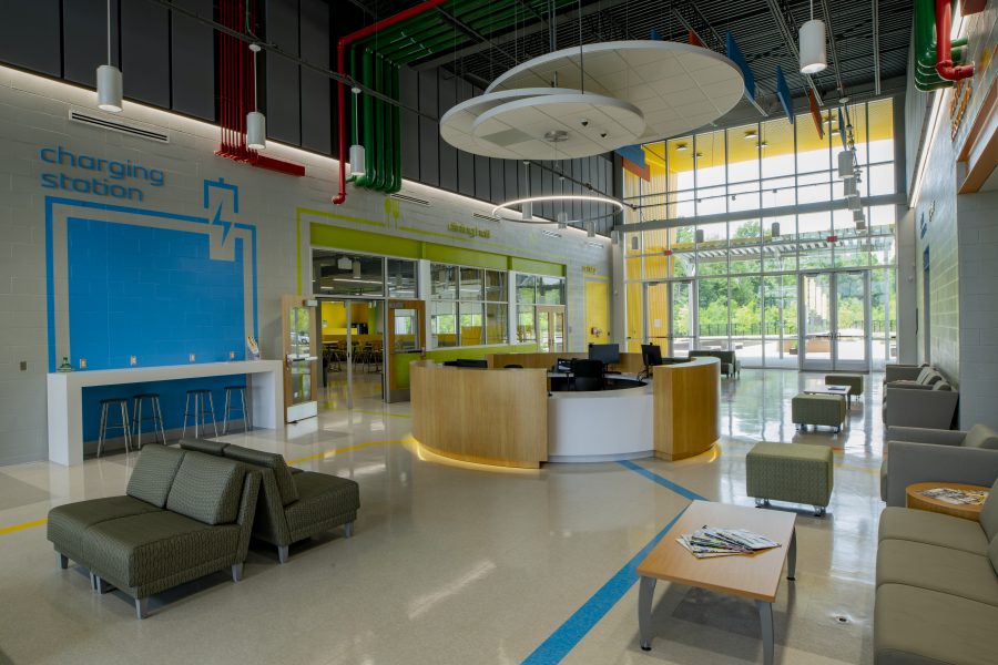 Student Common Area with bright colors, lounging areas, and circular reception desk