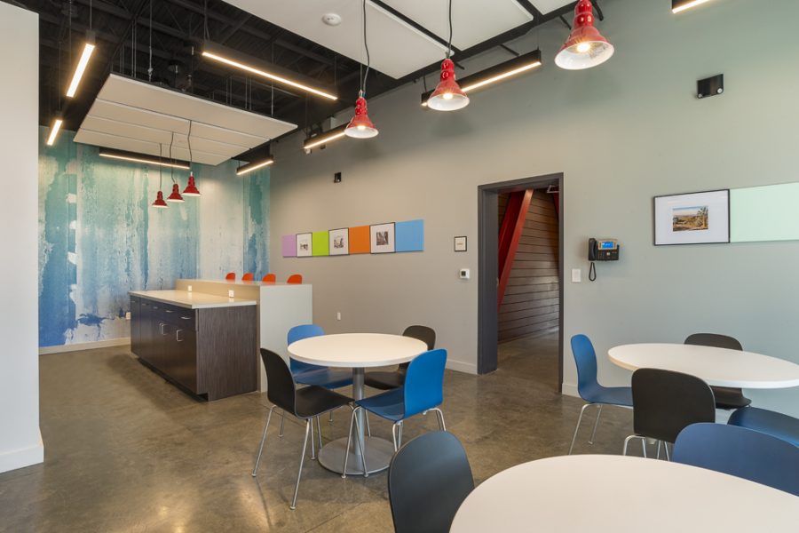 Break room with tables and colorful chairs