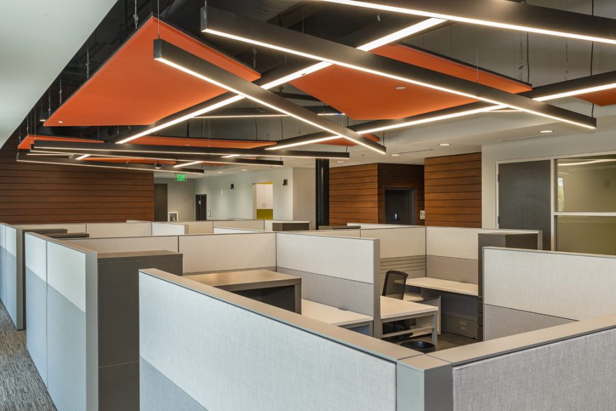 Bright orange geometric ceiling and open work spaces.