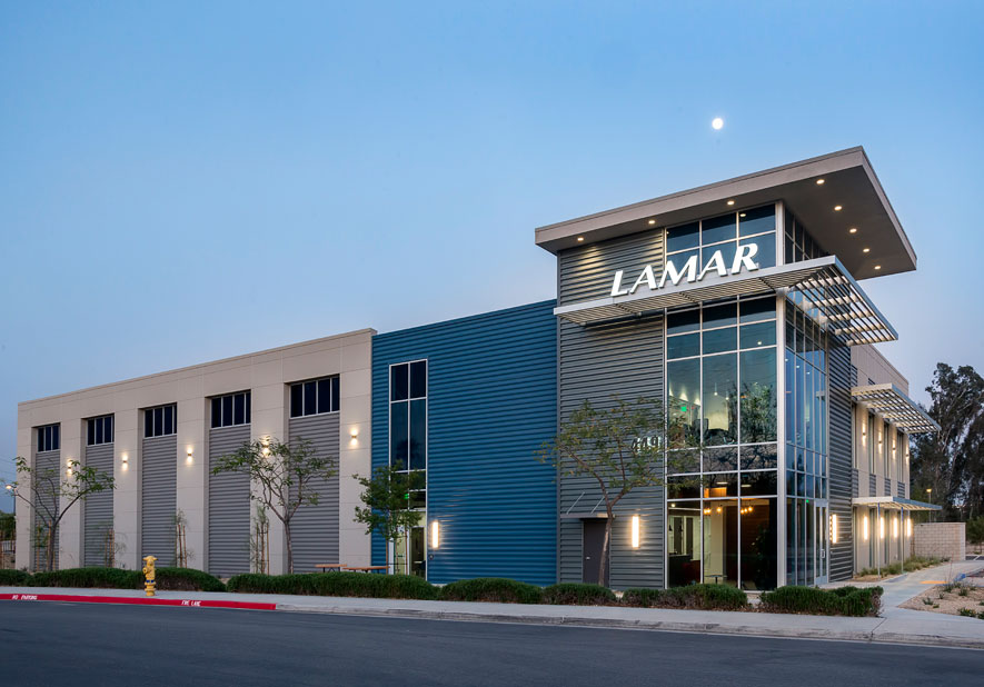 Stucco and horizontal metal panel exterior with aluminum canopies