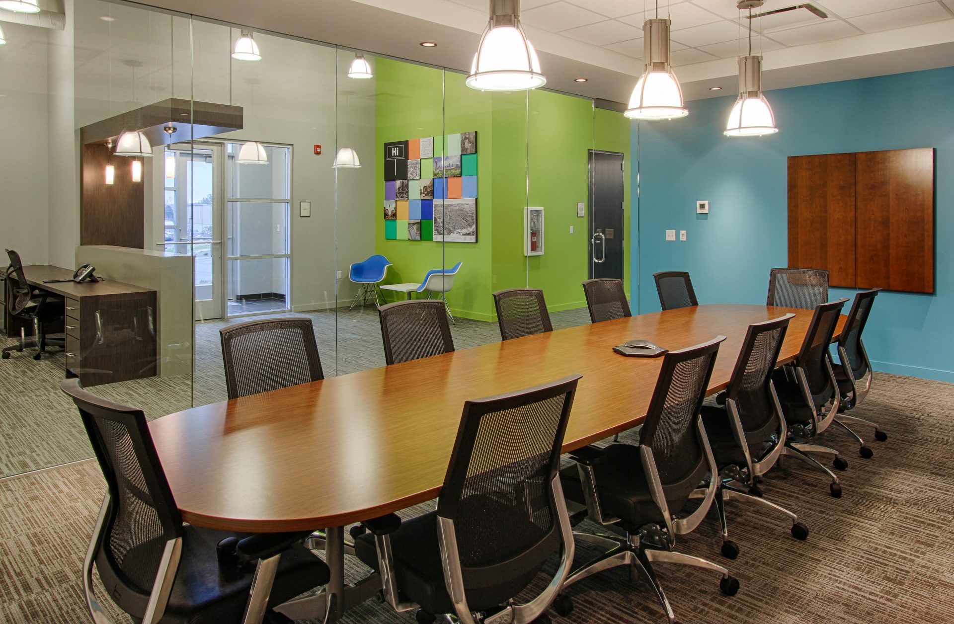 Conference room with long table and glass wall