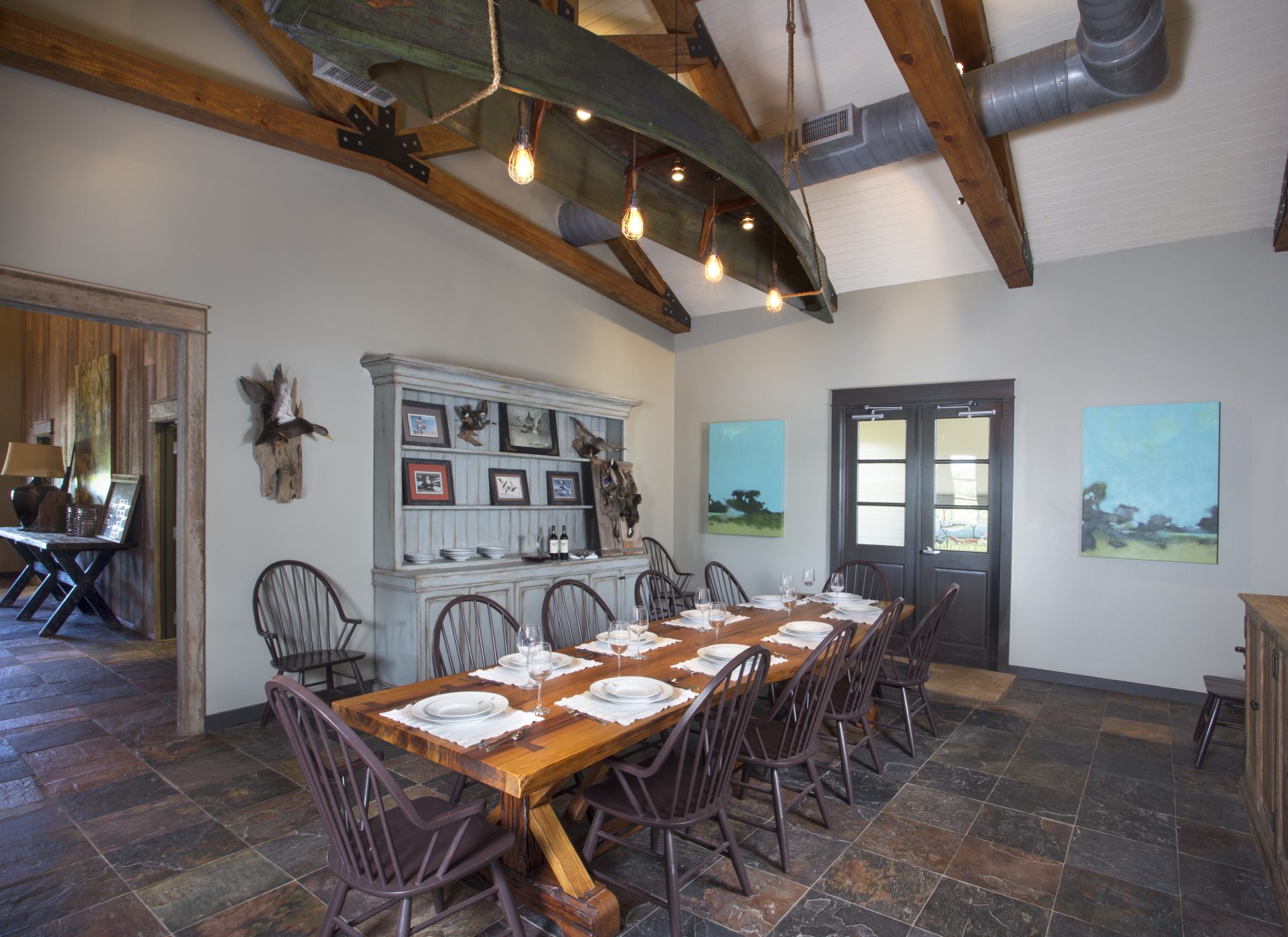 Dining room with large table setting at Lamar's Duck Camp.