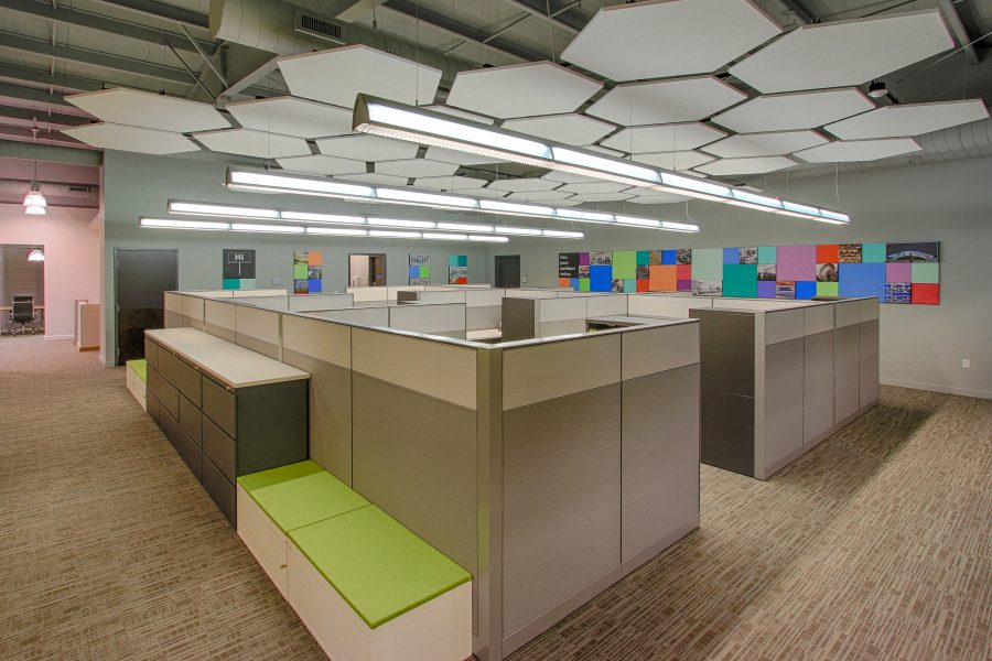 Open office space with hexagon ceiling tiles.