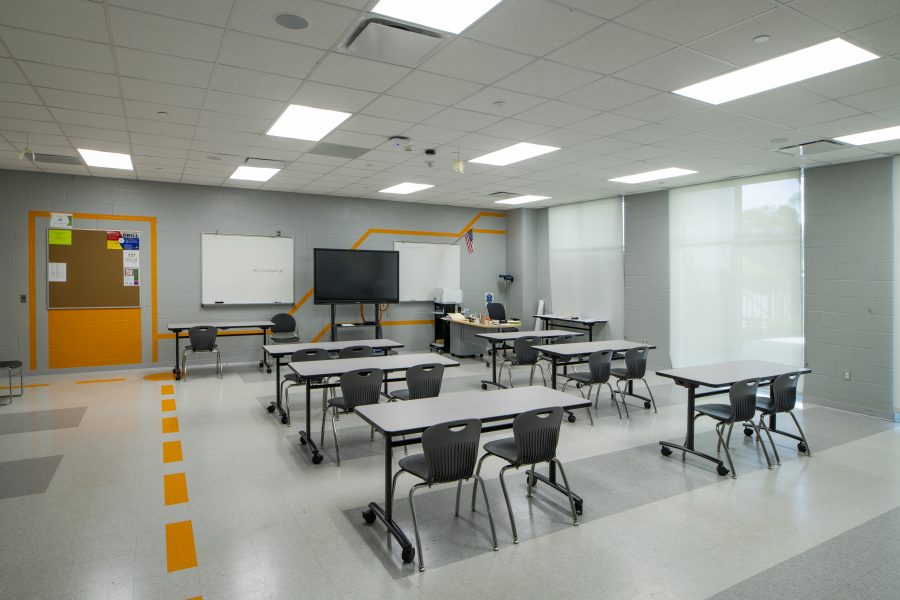 Empty classroom with orange wall graphics