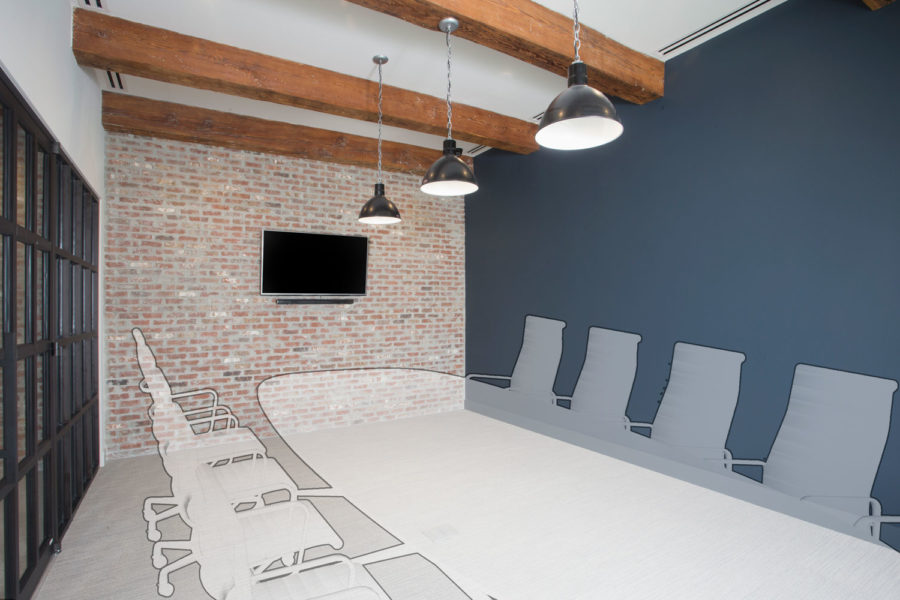 Conference room with brick wall and wooden trusses