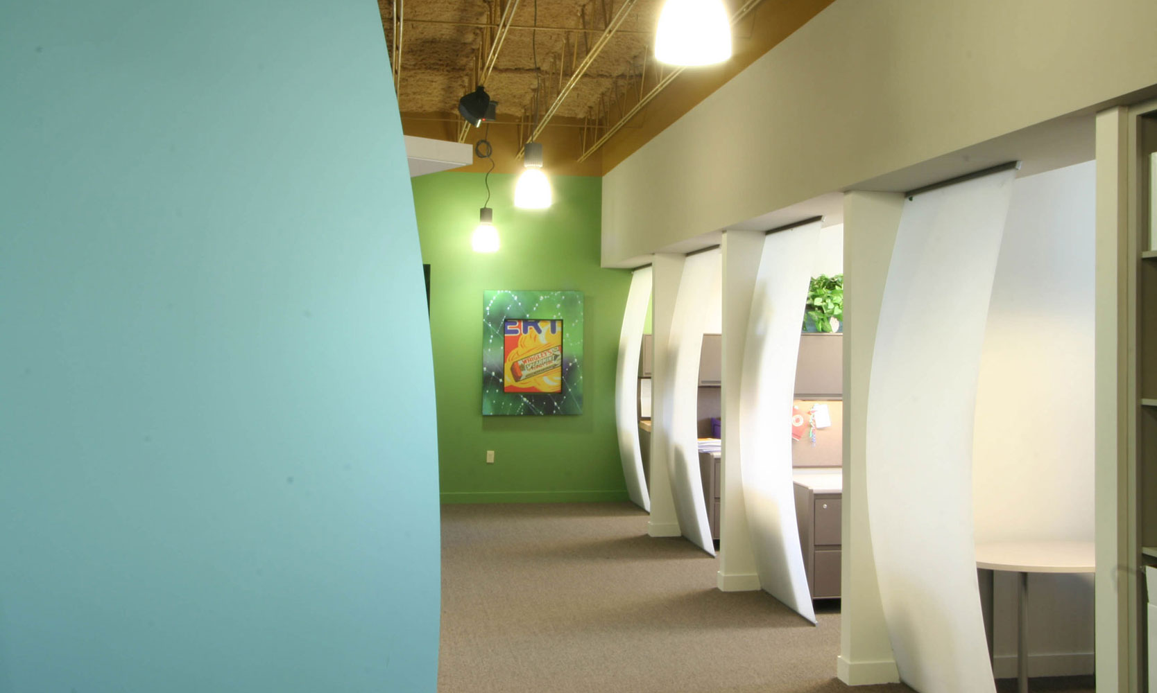 Bright colors in open office spaces with curved glass partitions