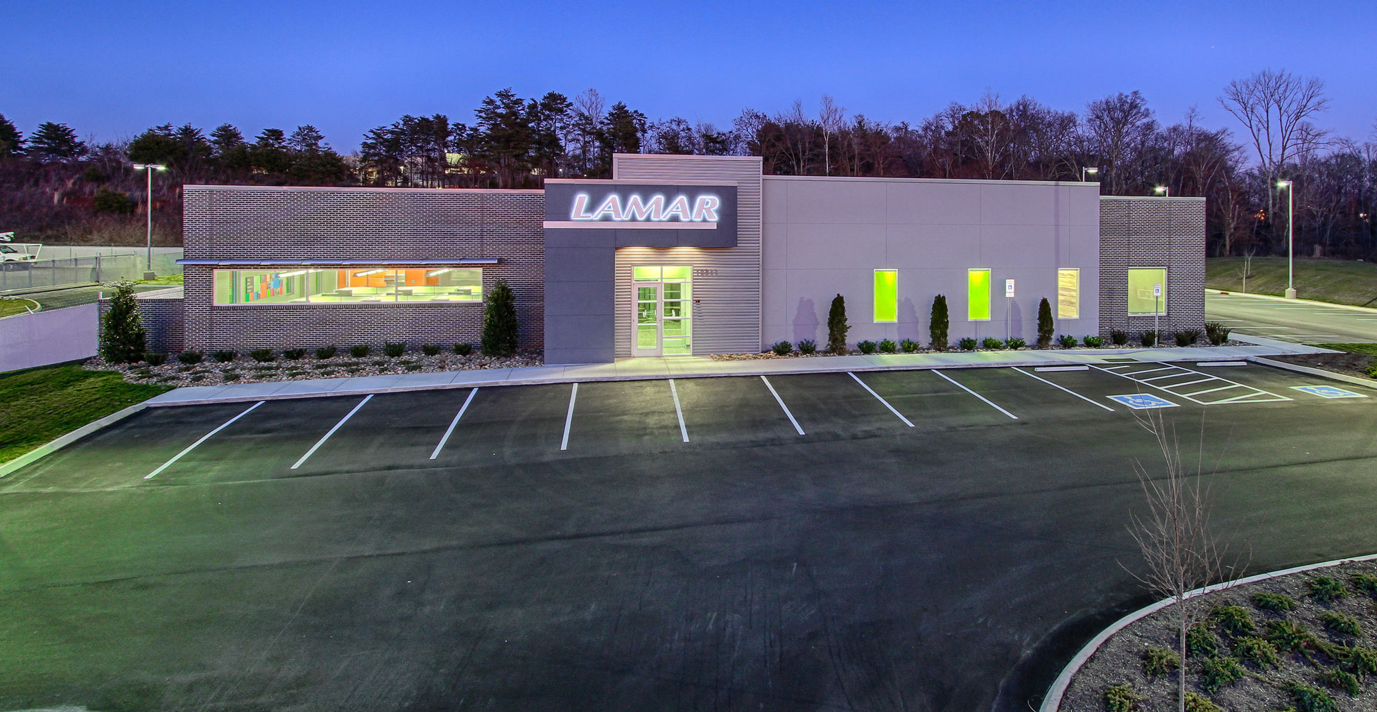 Exterior at night with backlit sign