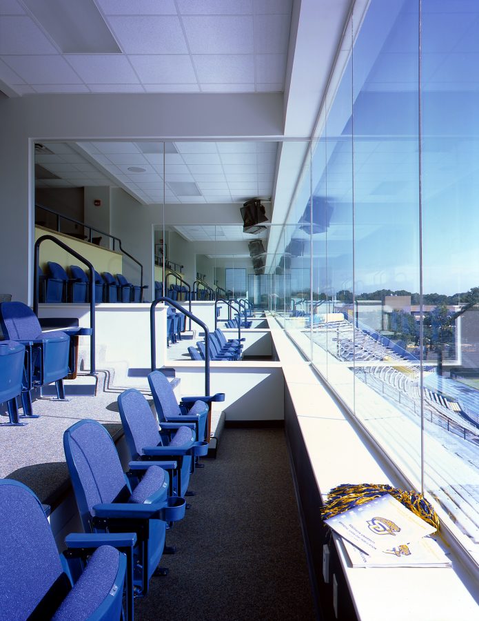 Press box seats overlooking the field.