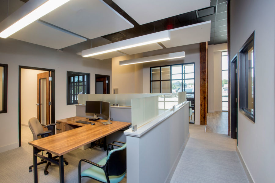 Open cubicles with high ceilings and square acoustical clouds