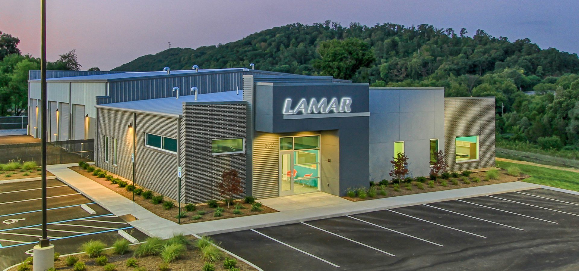 Brick and Stucco exterior with backlit building signage